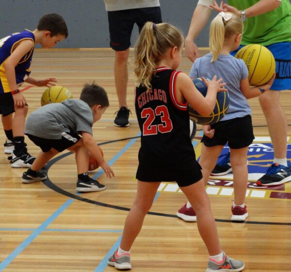 kids playing basketball together