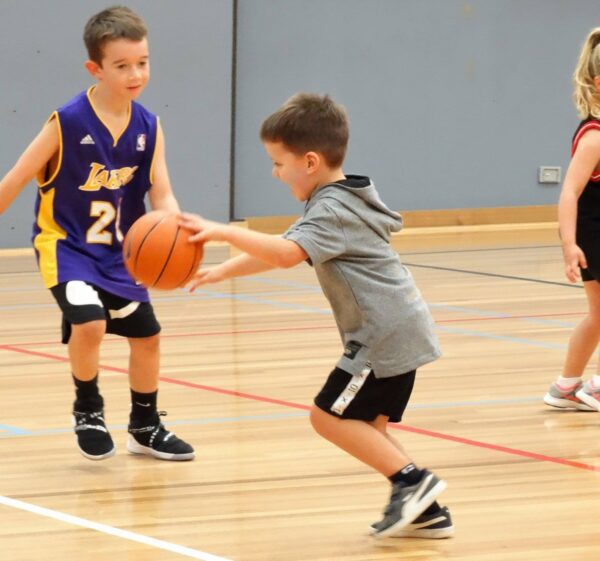 young kids playing basketball